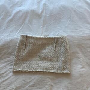 Helsa cream mini skirt with textured weave and frayed hem